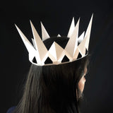 Paper crafting queen crown on girl's head